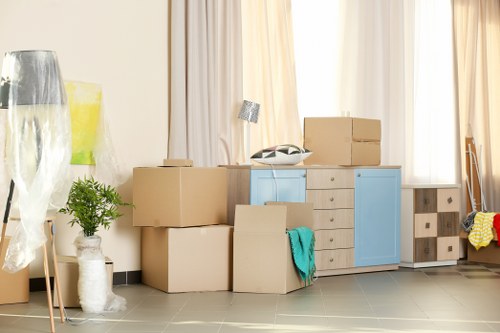 Moving van and packing boxes for a home move in West Ham