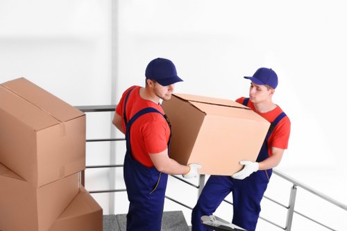 Local packing team organising boxes for a move near West Ham station