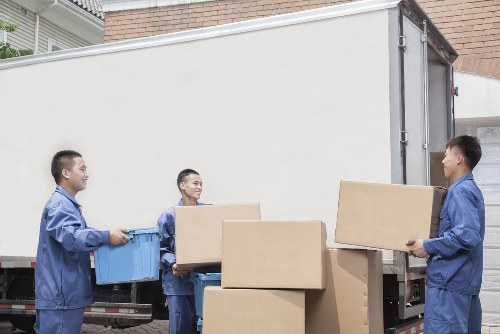 Moving team preparing belongings with safety equipment