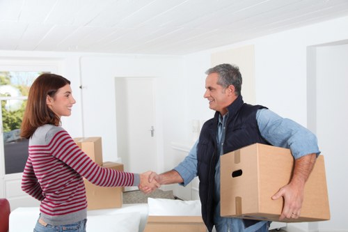 Local house moving team handling household items for a family relocation