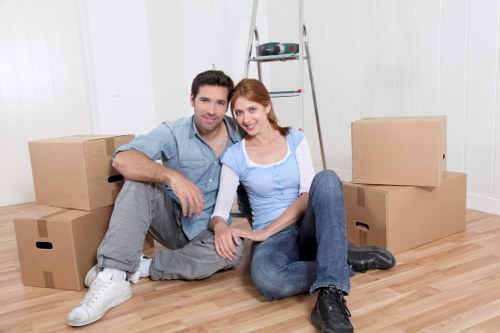 Professional movers handling furniture in West Ham near local streets