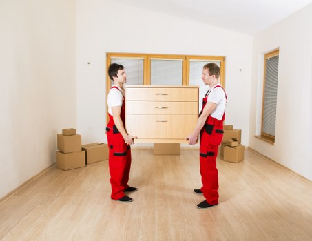 Boxes and furniture being loaded into a removals van